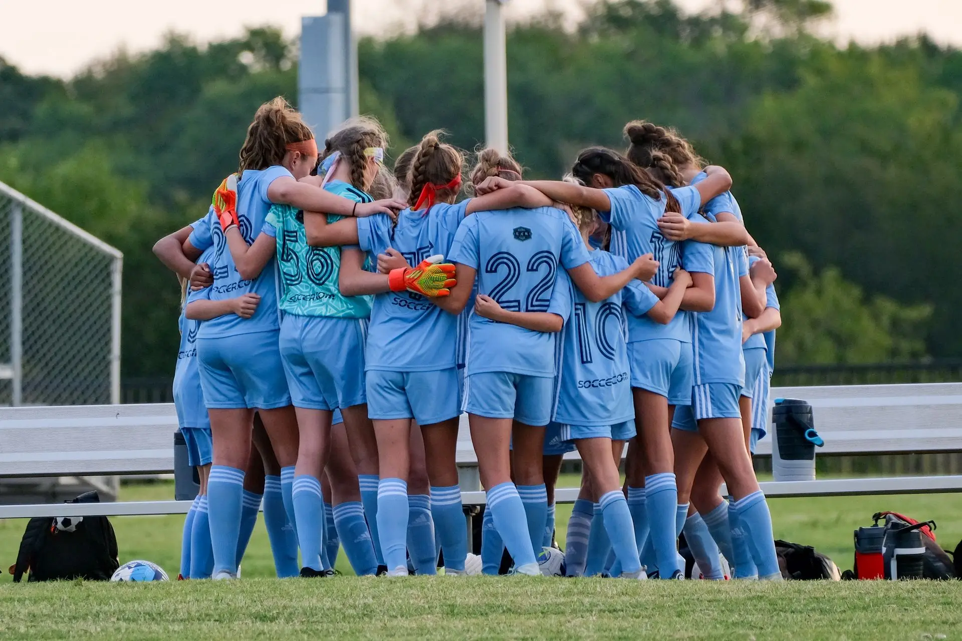Team huddle in matching jerseys