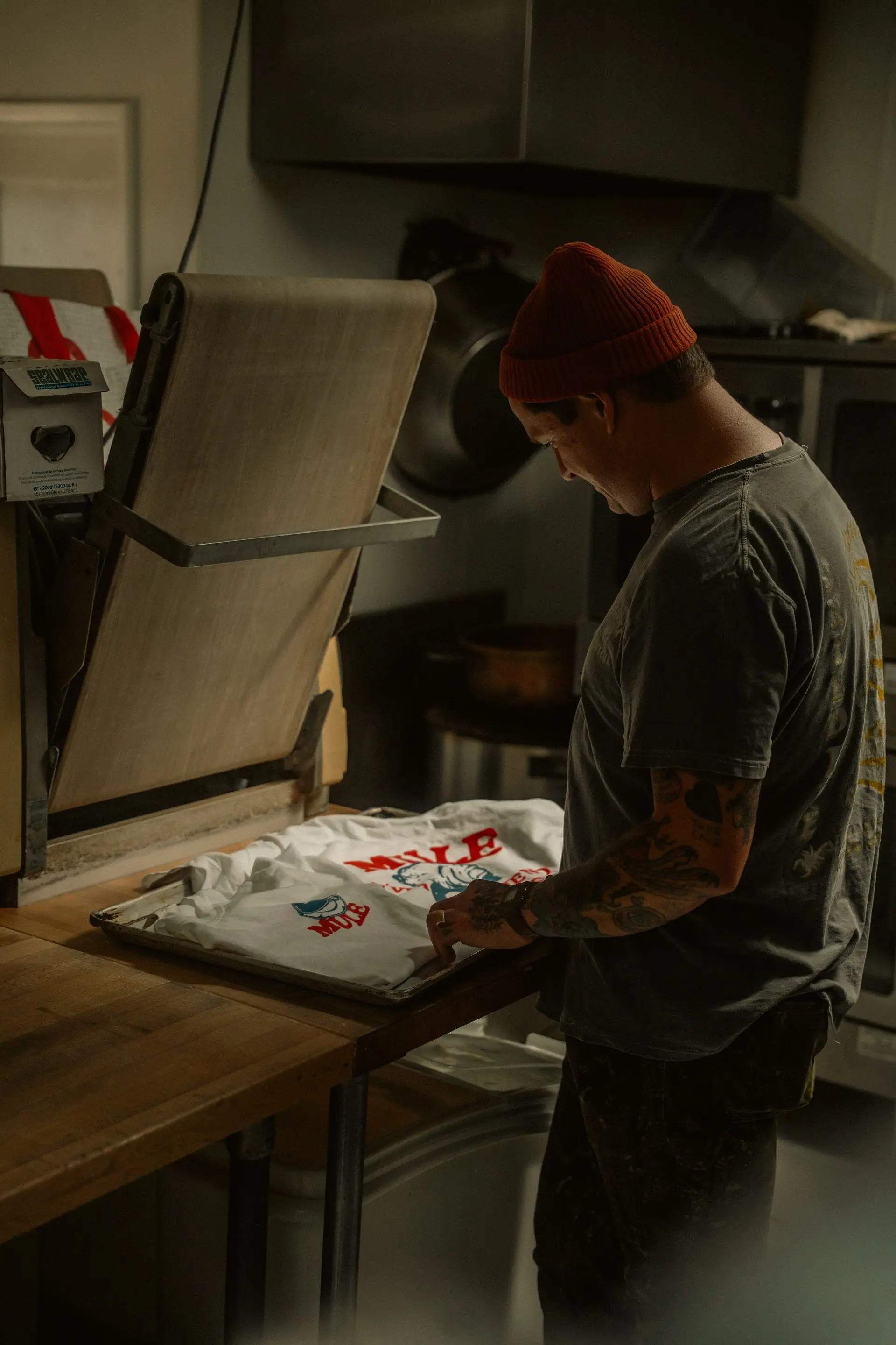 Heat press applying a transfer to a t-shirt