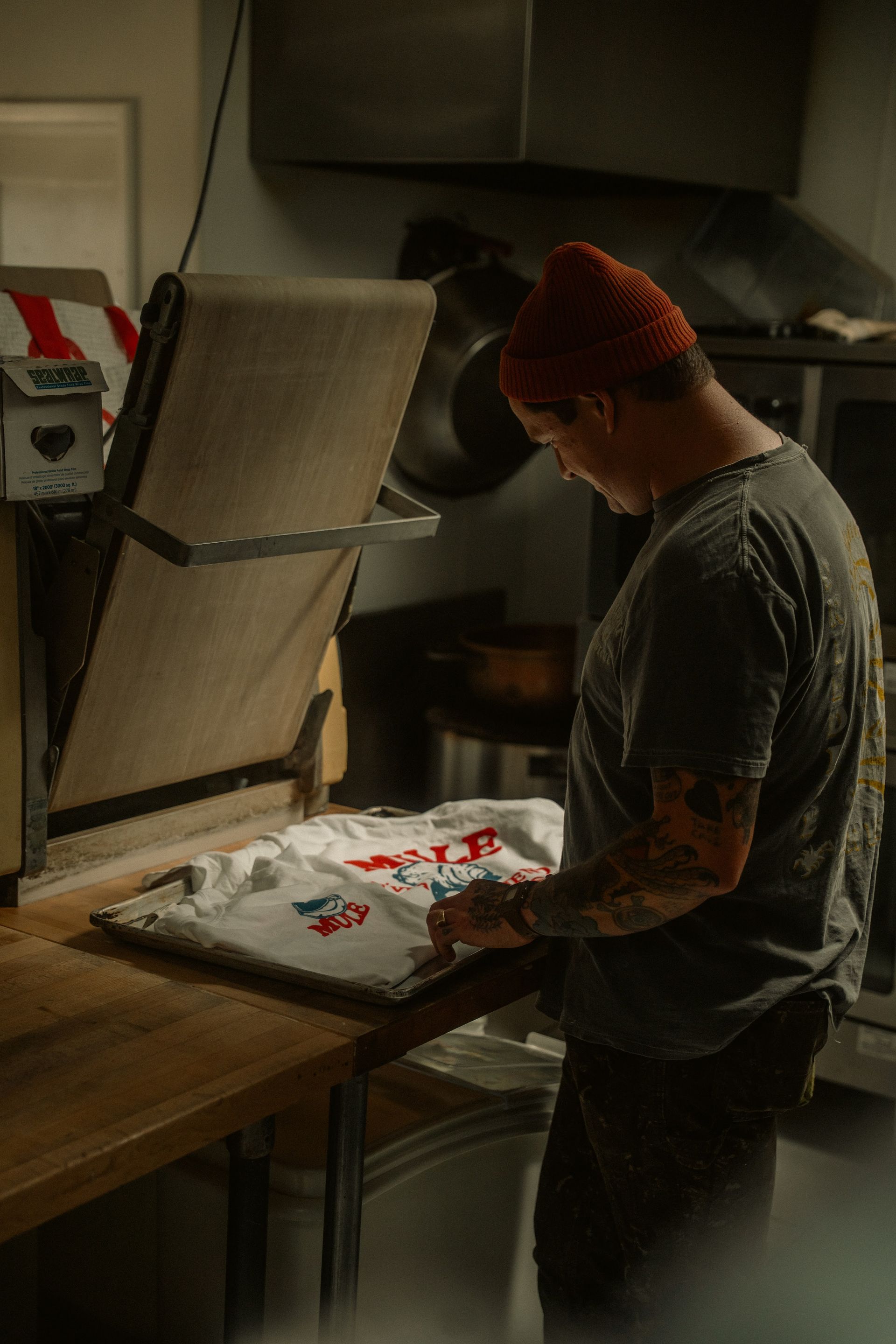 Heat press applying a transfer to a t-shirt