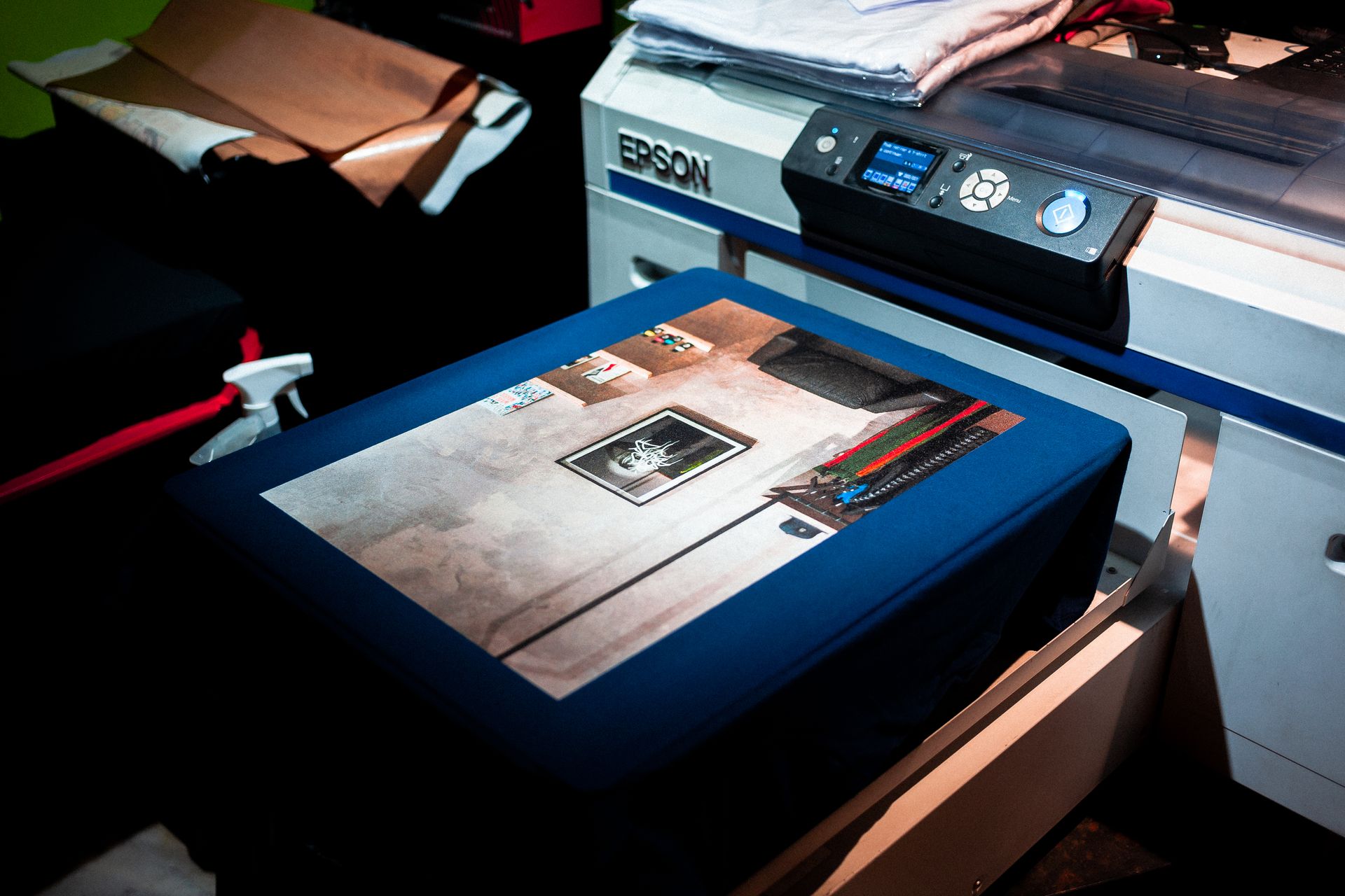 Direct-to-garment printer loaded with a shirt